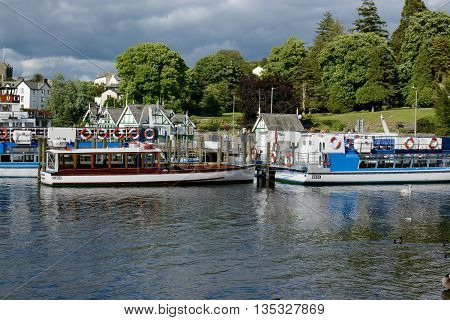 BOWNESS ON WINDERMERE, UK -  JUNE 20, 2016: Pleasure cruise boats at the pier, Bowness on Windermere, Cumbria, UK
