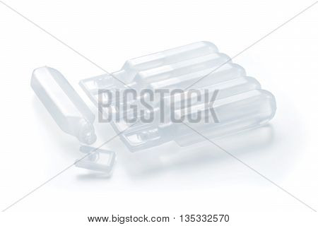 Group of modern plastic BFS (Blow Fill Seal) ampules one opened and pack of closed. Isolated on white with clipping path.