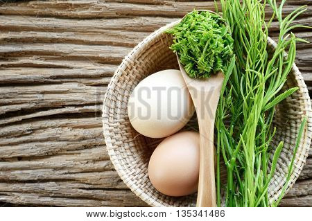 egg and acacia pennata prepare for omelet cooking Thai cuisine - calls that cha-om omelet