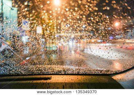 Bokeh Raindrops on the wind shield during driving