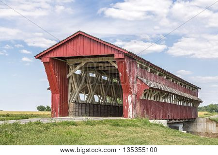 Built in 1868 the red Culbertson Covered Bridge also know as Winget Road Covered Bridge spans Treacle Creek in rural Union County Ohio.
