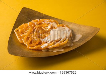 jalebi or imarati with rabdi made from condensing milk, famous dessert sweet from India