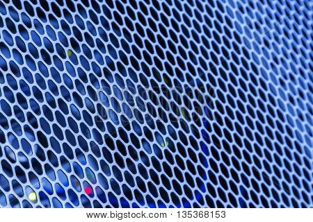 Detail on the blue metal grille on PC with small selective focus low depth of field