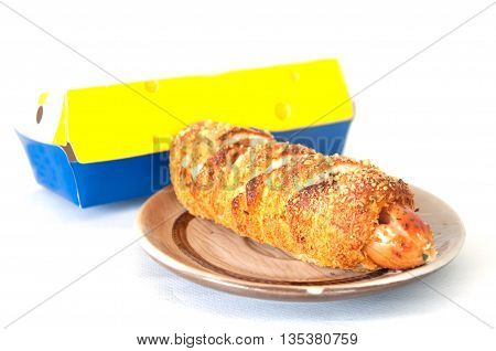 Hot dogs wrapped in crescent rolls with cheese in plate and product