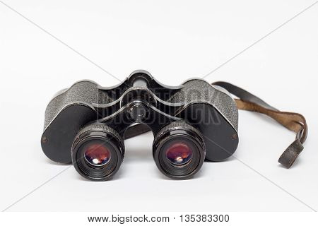 Classic binoculars or spyglass on a white background