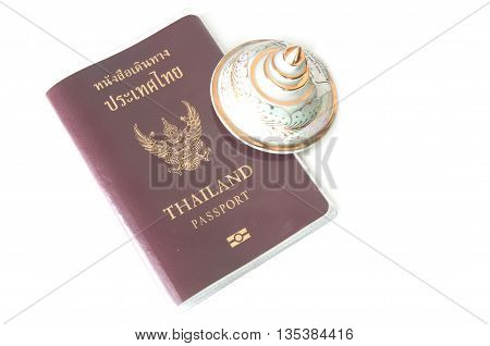Travel at Thailand passport and souvenir on white