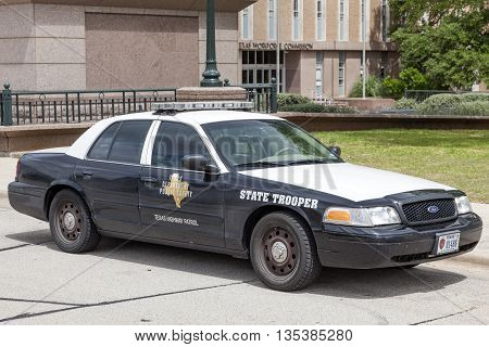 AUSTIN USA - APR 10: The State Trooper Texas Highway Patrol Police Car parked at the Texas State Capitol in Austin. April 10 2016 in Austin Texas USA