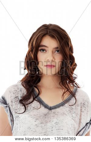 Young unhappy woman with long dark hair.