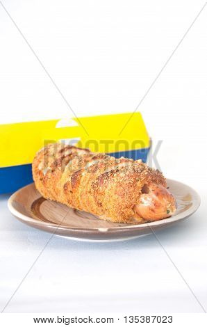 Hot dogs wrapped in crescent rolls on white