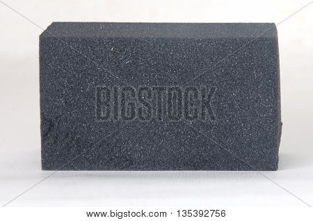 black sponge surface for cleaning on white background