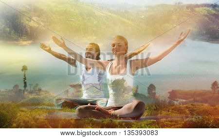 yoga retreat, fitness, sport and lifestyle concept - smiling couple making exercises sitting on mats outdoors, double exposure effect