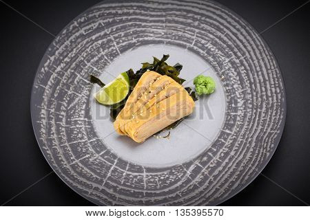 Japanese Cuisine. Sushi. Tomago  Sashimi On A Round Plate