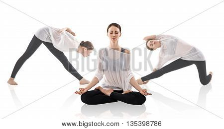 Young woman doing yoga exercise isolated over white background