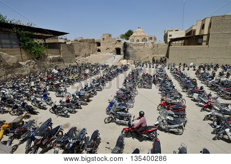 ISFAHAN - APRIL 19: Scooter parking near market (Bazaar) in Isfahan, Iran on April 19, 2015. Bazaar of Isfahan is the most important tourist attraction in Isfahan, Iran.