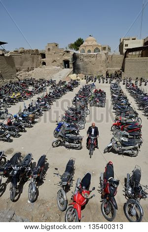 ISFAHAN - APRIL 19: Scooter parking near market (Bazaar) in Isfahan, Iran on April 19, 2015. Bazaar of Isfahan is the most important tourist attraction in Isfahan, Iran.