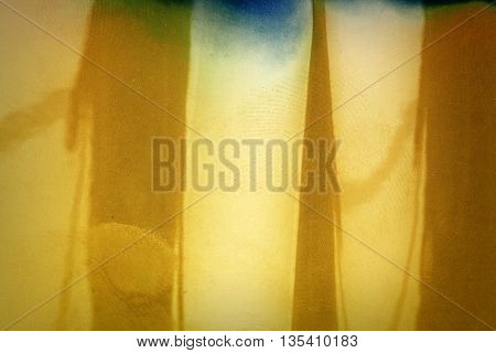 Blank yellow vibrant noisy film strip texture background with fingerprints