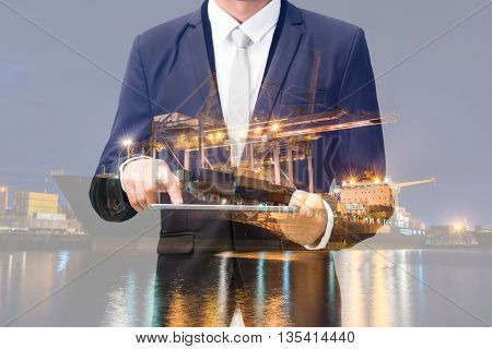 Double Exposure Of Businessman Hand Hold Tablet