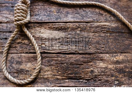 Rope With A Slipknot On The Wooden Background