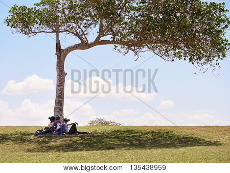 Youth culture young people group of male friends multiethnic teens playing with VR outdoors teenagers using virtual reality headset in park boys and modern technology. Future 3D hi-tech