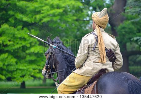 Silsoe, Bedfordshire, England - May 30, 2016:  A member of the Punjab Lancers in World War One uniform riding a horse.