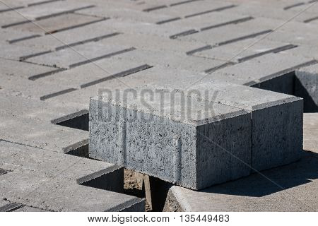closeup of paving stones on unfinished pavement