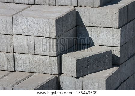 detail of grey paving stones stacked in pile