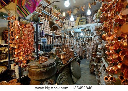 SHIRAZ - APRIL 14: Unknown man trades traditional metal crafts in a market (Vakil Bazaar) in Shiraz Iran on April 14 2015. Vakil Bazaar is the most important tourist attraction in Shiraz Iran.