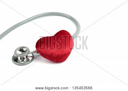 Stethoscope and red hearth on white background