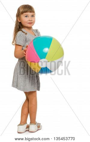 Beautiful little blond girl playing with a bouncy ball - Isolated on white background