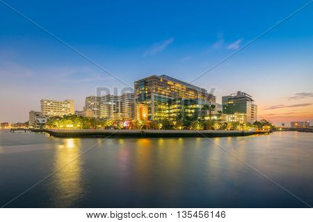 A beautiful shot of Siriraj hospital alongside Chao-phraya river at sunset