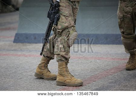 Legs Of Soldiers In Camouflage