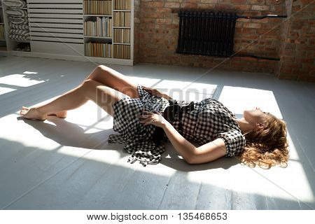 sexy woman on the floor in provocative pose
