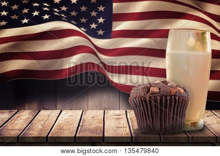 Focus on muffin against composite image of digitally generated united states national flag