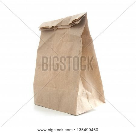 A used brown paper bag on a white background.