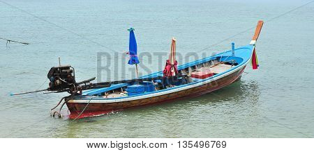Anchor local long tailed ship waiting for customer in Thailand.