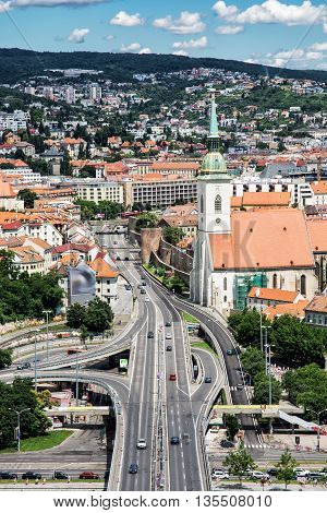 Saint Martin's cathedral and bridge SNP in Bratislava Slovak republic. Architectural theme. Capital city. Cultural heritage. Travel destination. Beautiful place. Vertical composition.