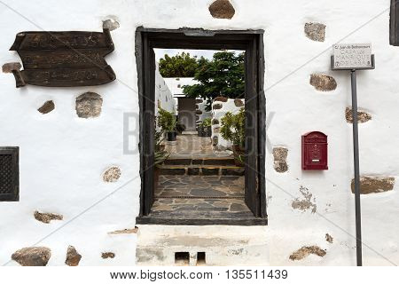 BETANCURIA, SPAIN - SEPTEMBER 16, 2015: Old black entrance gate in Betancuria village on on Fuerteventura Canary Islands Spain