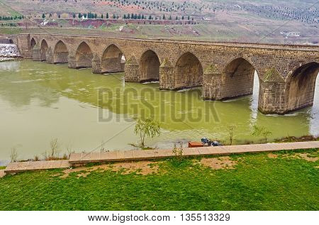 The huge Dicle Bridge is the fine example of the old islamic architecture Diyarbakir Turkey.