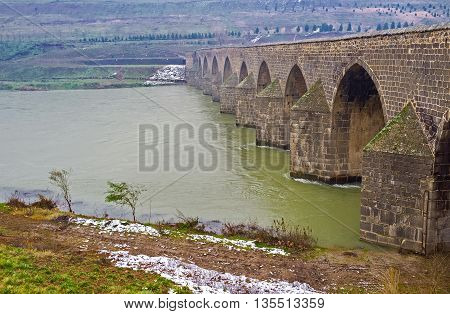 The Dicle Bridge during the misty and rainy winter weather Diyarbakir Turkey.