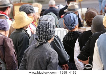 Many People With Old Haircloth Waiting