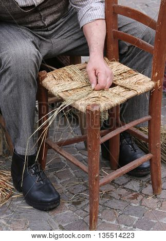Old Mender Of Chairs While With Straw Shelters The Old Wooden Ki