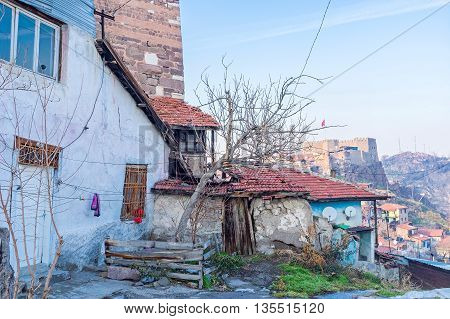 The dilapidated leaving house on the Castle Hill of Ankara with Hisar citadel on the background Turkey.