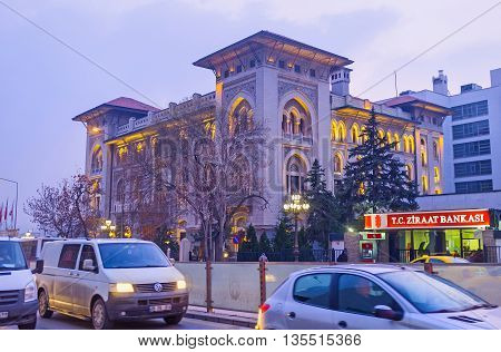 ANKARA TURKEY - JANUARY 16 2015: The evening view on the traffic jam on the road and the headquarters of the Ziraat Bank the country's largest and oldest financial institution on January 16 in Ankara.