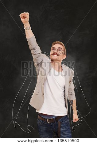 Man in superhero pose doing fly gesture. Imaginary super guy, super hero costume drawing at black gradient background. Young man shows flying pose, achievment, success, power, strong guy concept.