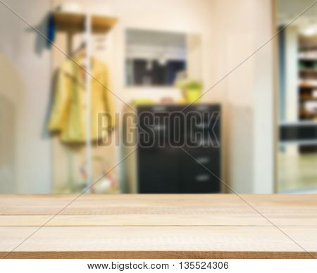 Wooden empty table in front of blurred background. Perspective light wood over blur in modern apartment interior. Mock up for display or montage your products