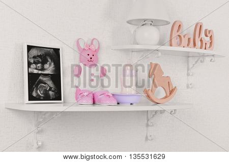 Photo frame with ultrasound scan of baby and accessories on shelves close-up