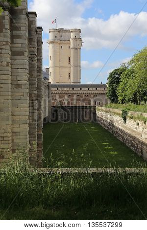 PARIS, FRANCE - MAY 15, 2015: This is donjon and part of the fortress walls with a former moat of the castle of Vincennes.