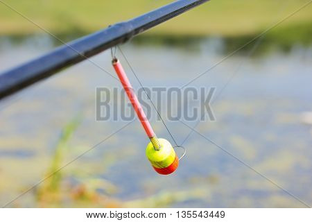 The tip of the rod with the bell.