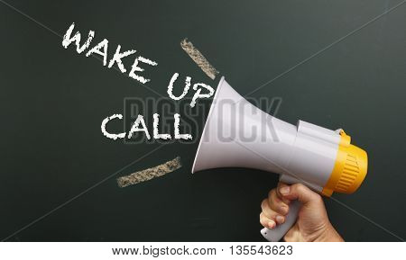 megaphone with text wake up call