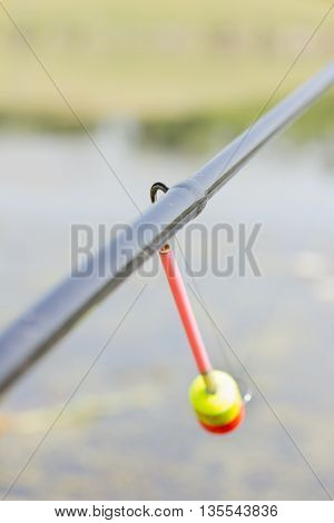The tip of the rod with the bell.